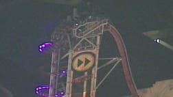 >A dozen thrill seekers were stuck for more than two hours 17 stories above an Orlando amusement park Wednesday, sitting flat on their backs, facing the sky and secured only by their lap bars.