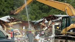  The homes on either side of the Tampa area house where a sinkhole opened under a man's bedroom are being demolished.