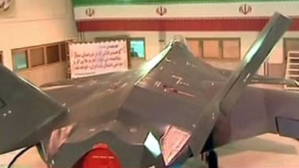 Iranian President Mahmoud Ahmadinejad has unveiled the country's newest fighter jet, which officials claim can evade radar.