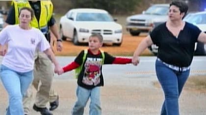 The Alabama mother of the -year-old boy held hostage in an underground bunker for five days is 'hanging on by a thread,' said a local politician who visited the woman.