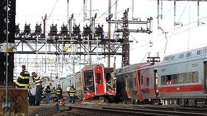 The commuter train derailment and collision that left dozens injured outside New York City was not the result of foul play, officials said Saturday, but a fractured section of rail is being studied to determine if it is connected to the accident.
