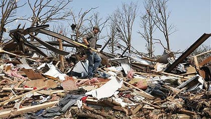 A massive tornado at least a half mile-wide with mph winds churned through Oklahoma City's suburbs Monday afternoon, flattening entire neighborhoods and destroying an elementary school with a direct blow as children and teachers huddled against winds up to  mph. At least  people were killed, and officials said the death toll was expected to rise.