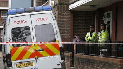 The wife of the British soldier hacked to death in an apparent terror attack told reporters Friday she will miss him terribly, as police identified the second suspect being held in connection with the murder.