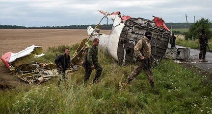 Monitors work to secure Malaysia Airlines crash site as Ukraine accuses Russia of destroying evidence