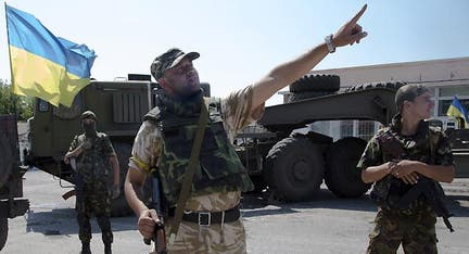 Putin threatens to break Ukraine's blockade of Donetsk as rebels vow 'another Stalingrad'