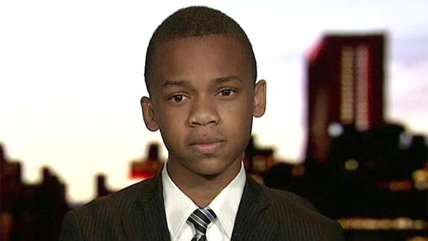 'Not worth saving in a fire': Pint-size conservative CJ Pearson claims teacher dissed him - VIDEO: 12-year-old challenges President Obama to a meeting