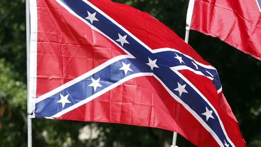 SYMBOL PROHIBITED Confederate flag banned from school parking lot