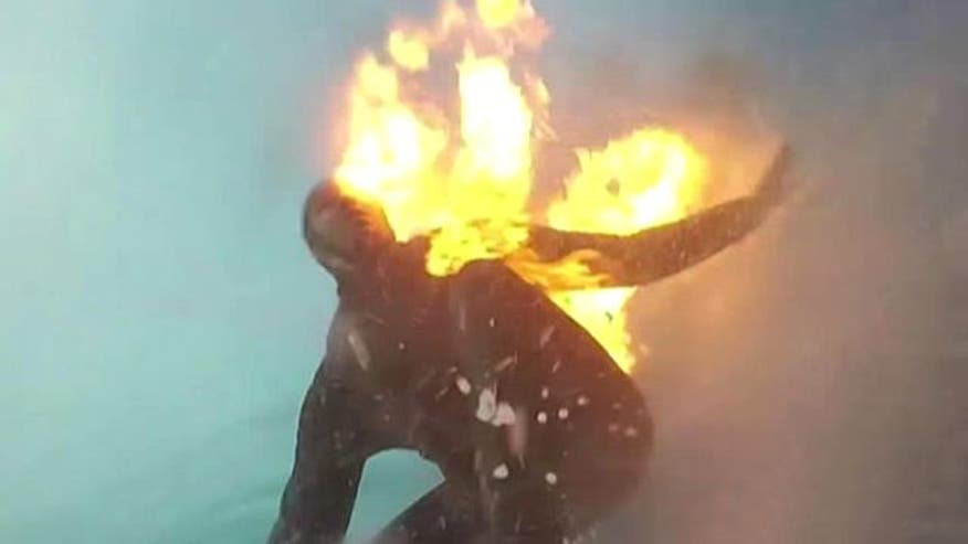 Daredevil surfer on fire