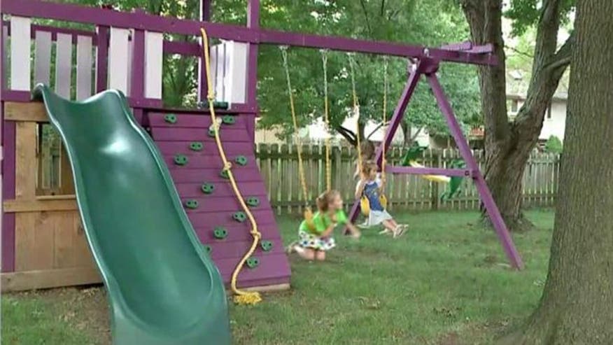 PURPLE POWER Judge rules Mo. family can keep colorful swingset