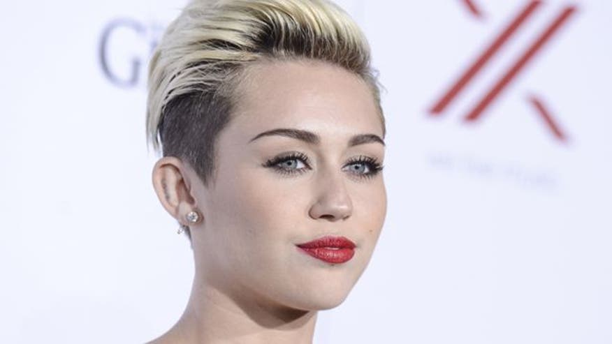 Miley posts raunchy reshoot