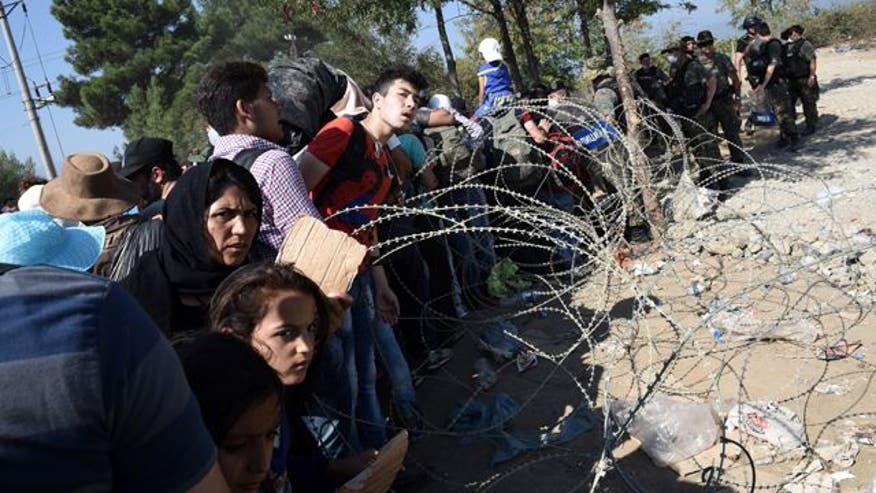 MIGRANT CHAOS Hungary pushes back at refugee surge, shuts trains