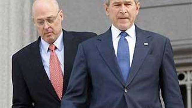Monday: President Bush meets with Treasury Secretary Hank Paulson to discuss the Citigroup bailout (AP Photo).
