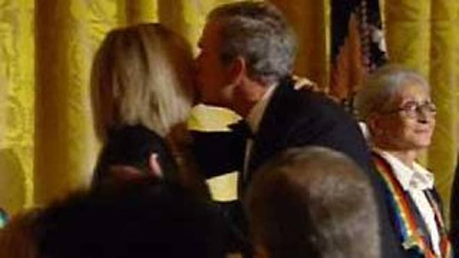 Sunday: President Bush kisses singer Barbra Streisand, who was honored by the Kennedy Center  (FNC).