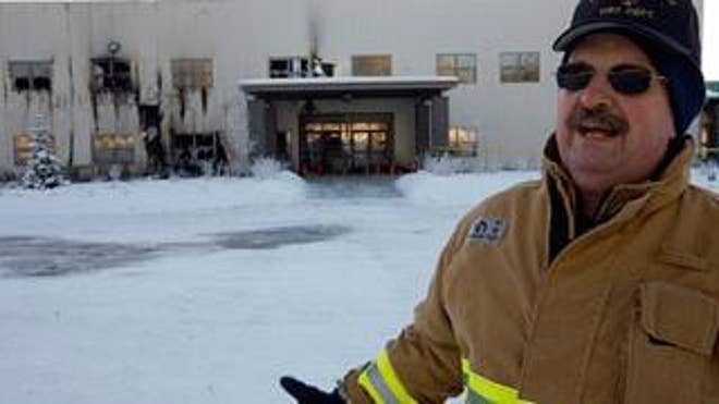 Dec. 13: James Steele, fire chief for the Central Mat-Su Fire Department, stands outside the fire-damaged Wasilla Bible Church in Wasilla, Alaska.