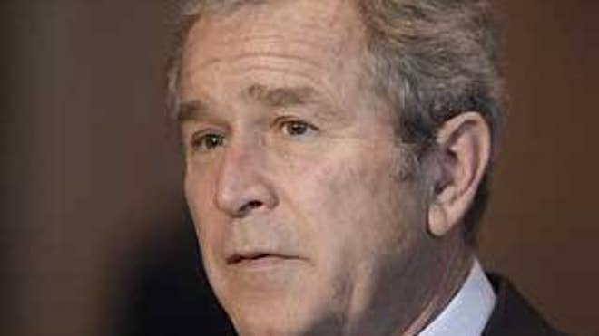 President George W. Bush makes a statement to reporters at Walter Reed Army Medical Center where he met with wounded soldiers in Washington, Monday, Dec. 22, 2008. (AP Photo/Charles Dharapak)