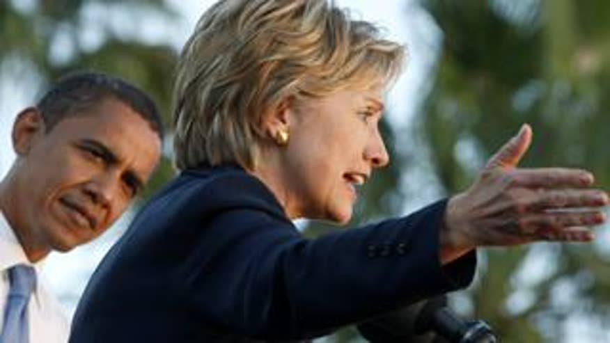 Barack Obama and Hillary Clinton attend a campaign rally in Orlando, Florida, during Obama's race for the White House. (Reuters File)
