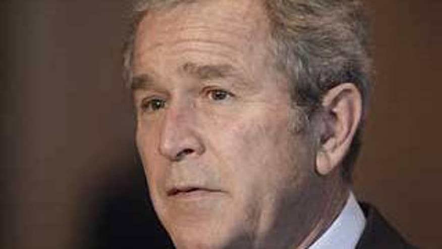 President George W. Bush makes a statement to reporters at Walter Reed Army Medical Center where he met with wounded soldiers in Washington, Monday, Dec. 22, 2008. (AP Photo/Charles Dharapak)