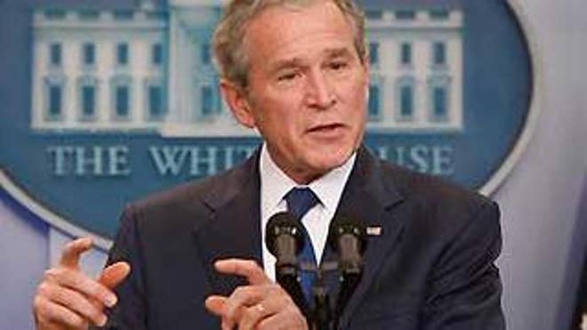 Jan. 12: President Bush gestures at his final press conference with the White House press corps (AP Photo).