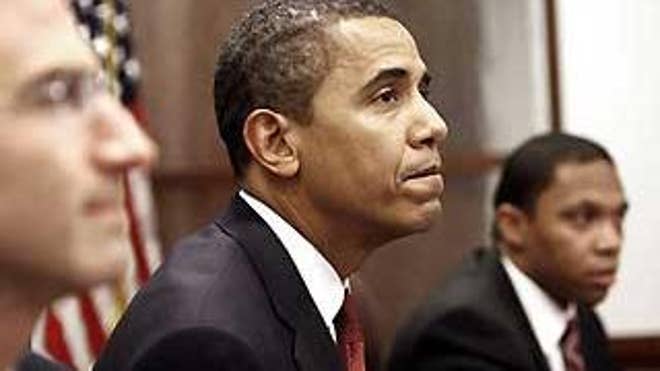 President-elect Barack Obama, flanked by Budget Director-designate Peter Orszag, left, and Deputy Budget Director-designate Rob Nabors, speaks to reporters after a meeting with his top economic advisers at his transition office in Washington, Tuesday, Jan. 6, 2009. (AP Photo/Gerald Herbert)