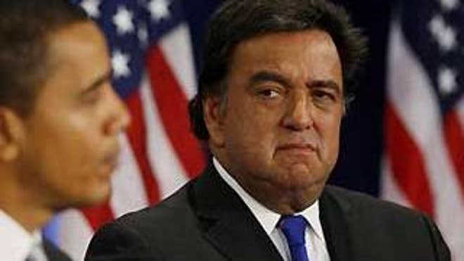 In this Dec. 3, 2008 file photo, President-elect Barack Obama stands with Commerce Secretary designate, New Mexico Gov. Bill Richardson, at a news conference in Chicago.