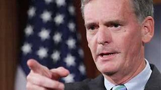 In this Sept. 28, 2008 photo, Sen. Judd Gregg responds to questions from reporters on Capitol Hill. (AP Photo)