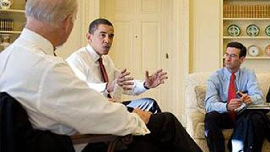 President Obama sits in his shirtsleeves during a meeting in the Oval Office. (Pete Souza/White House)