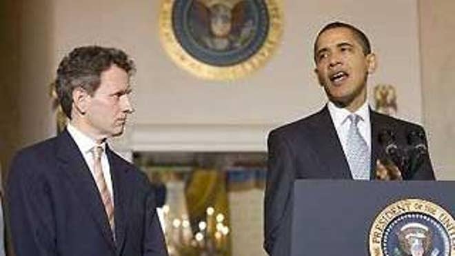President Obama speaks about the auto industry at the White House Monday, as Treasury Secretary Timothy Geithner looks on. (Reuters Photo)