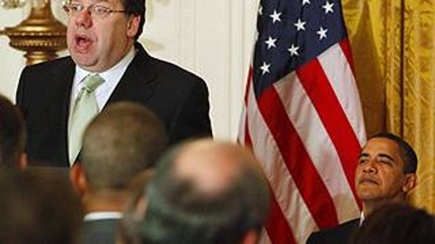 Irish Prime Minister Brian Cowen speaks as President Obama listens in the East Room of the White House.