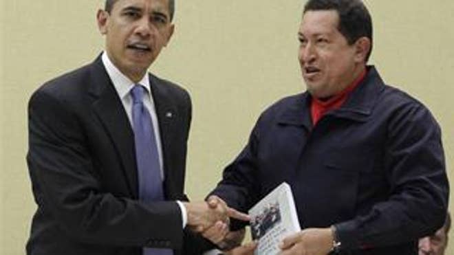 Hugo Chavez hands President Obama the book titled "The Open Veins of Latin America" by Uruguayan writer Eduardo Galeano