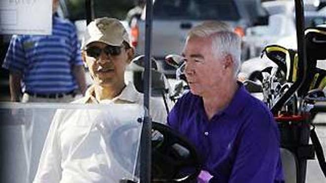 April 26: President Obama gets a lift from Mike Thomas, general manager of the golf courses at Andrews Air Force Base, Md. (AP Photo)