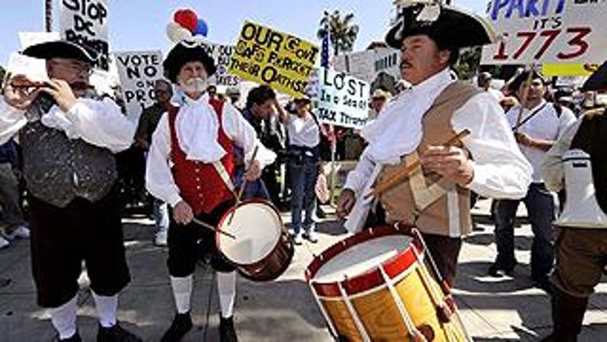 Activists wearing Boston Tea Party-themed costumes participate in a tax revolt rally in Santa Barbara, California, in this April 4, 2009 file photo. (Reuters)