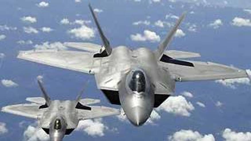 Two F-22 Raptor aircraft are shown in this April 2, 2007, file image provided by the U.S. Air Force. (AP Photo)