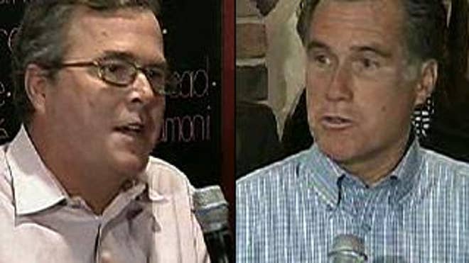 Jeb Bush and Mitt Romney at a Republican-hosted town hall meeting