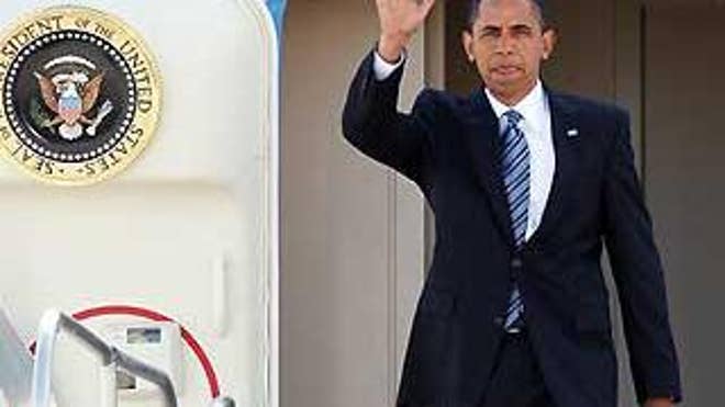 President Obama waves as he exits Air Force One upon arrival in Las Vegas Tuesday. (AP Photo)