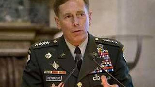 Gen. David Petraeus, shown here at a December press conference in Rome, is praising Pakistan for its fight against the Taliban. (Reuters Photo)