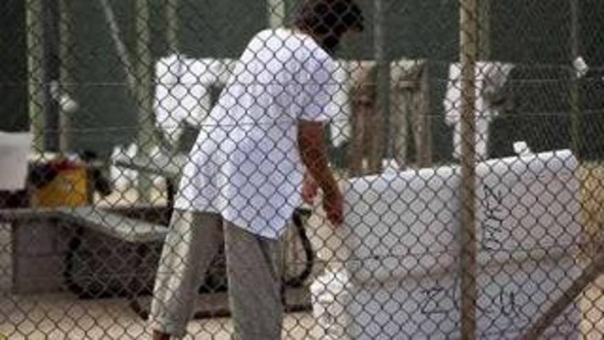 A Guantanamo detainee opens a cooler inside the Guantanamo Bay prison