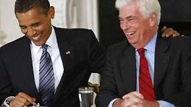 President Obama and Connecticut Sen. Chris Dodd laugh during a health care meeting with other Senate Democrats at the White House in Washington June 2. (Reuters Photo)