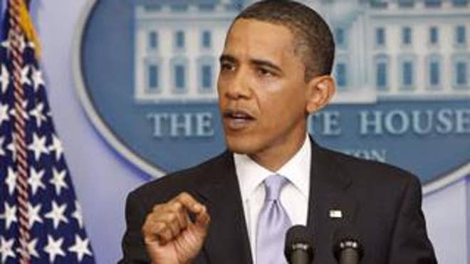 President Obama gestures as he answers a question at a news conference at the White House Tuesday. (AP Photo)