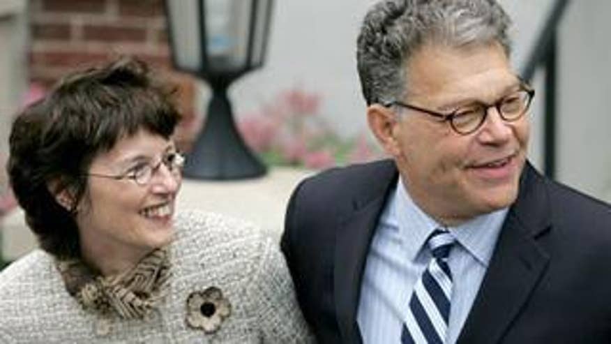 Al Franken and his wife, Frannie Franken, smile.