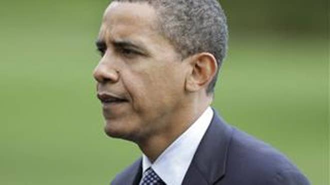 President Barack Obama walks to the White House