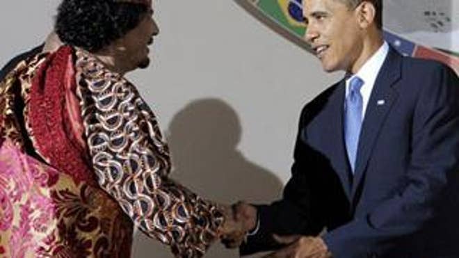 President Obama Shakes Hands With Muammar al-Qaddafi