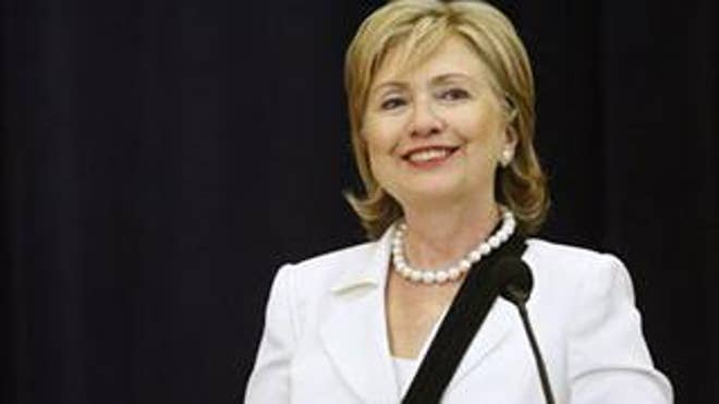 Secretary of State Hillary Clinton reacts to a question at a town hall meeting at the State Department Friday. (AP Photo)