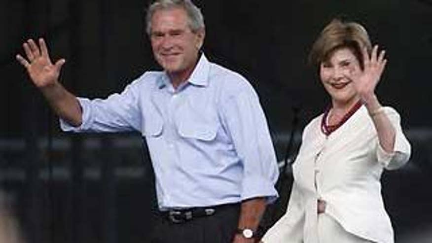 July 4, 2009: Former President George W. Bush arrives with wife Laura Bush at the Let Freedom Ring 2009 festival at Crystal Beach Park Arena in Woodward, Okla.