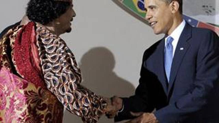 President Obama Shakes Hands With Muammar al-Qaddafi