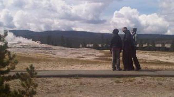 President Obama and his two daughters at Yellowstone National Park