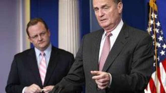 National Security Adviser Jim Jones speaks to reporters at the White House in Washington May 6. At left is White House Press Secretary Robert Gibbs. (Reuters Photo)