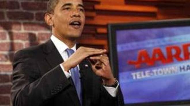 President Obama participates in a tele-conference town hall on health care at the AARP in Washington Tuesday. (Reuters Photo)