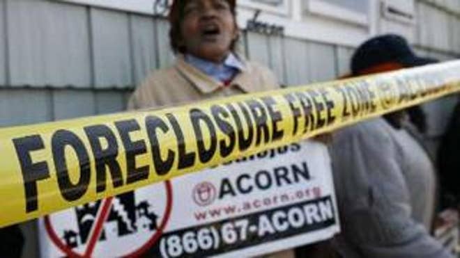 Demonstrators from ACORN's Home Defenders rally outside a foreclosed home in Elmont, N.Y., April 9. (Reuters Photo)