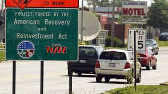 Highway sign declaring, "Project Funded by the American Recovery and Reinvestment Act."