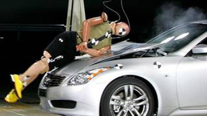 This crash-test dummy might have needed health insurance before getting hit by this Nissan Skyline. (AP Photo)